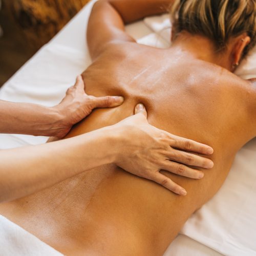 woman receiving a treatment on her back